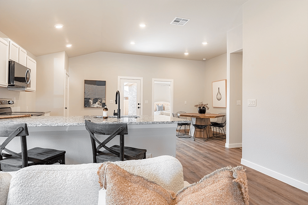 Kitchen & dining in the Giselle, one of Betenbough's homes with kitchen peninsula.