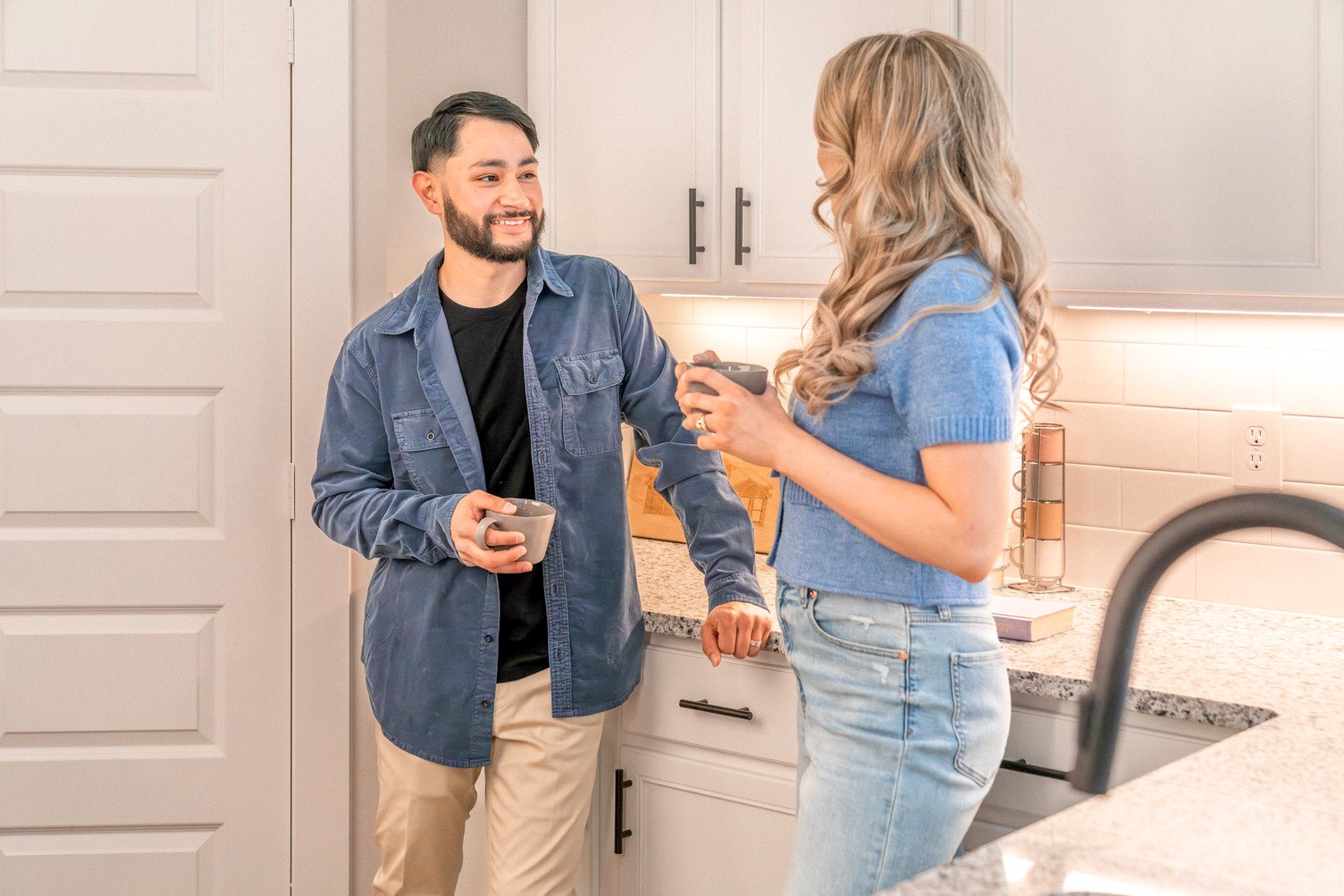 Happy couple in their kitchen
