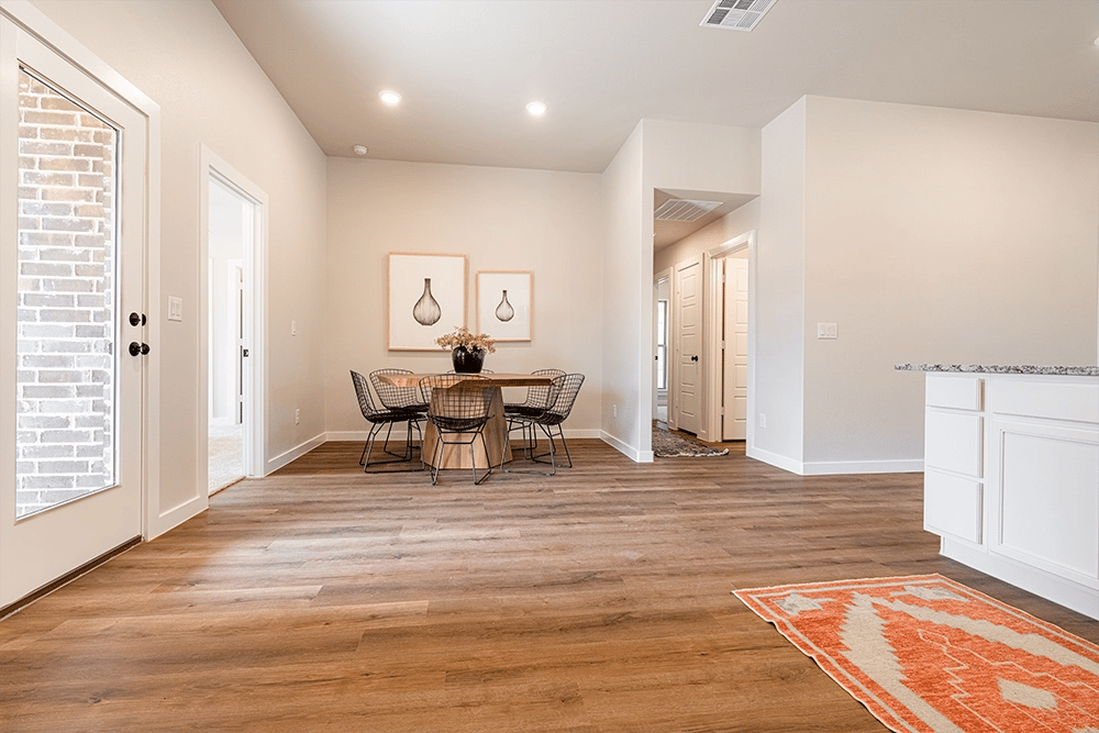Dining room in the Regan, one of Betenbough's homes with kitchen peninsulas.