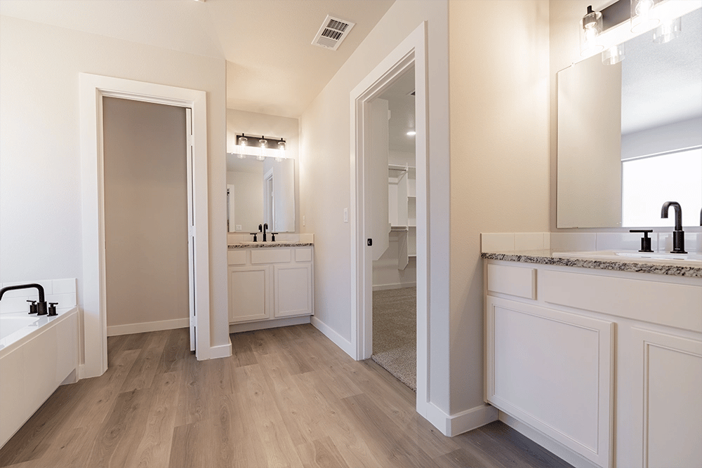 His & hers vanities in the Rebecca, one of Betenbough's homes with open floor plan.