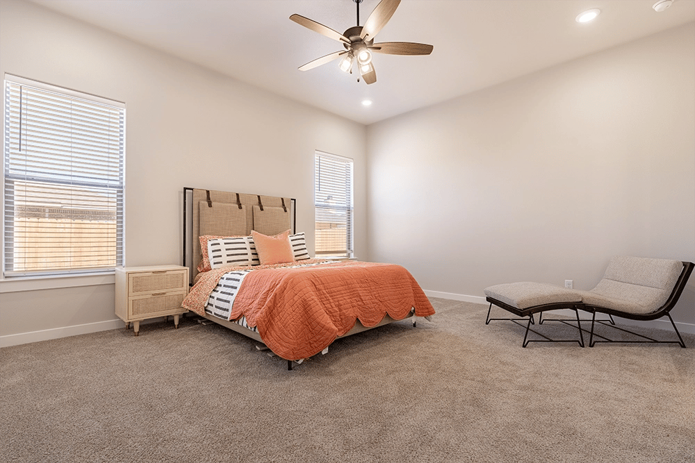 Furnished bedroom in the Rebecca, a Betenbough Homes floor plan.
