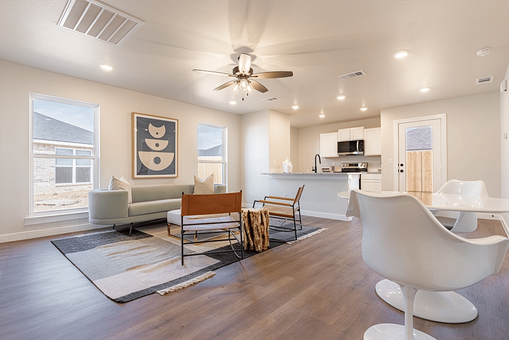 Dining area, living area, & kitchen in the Priscilla, a Betenbough Homes floor plan.