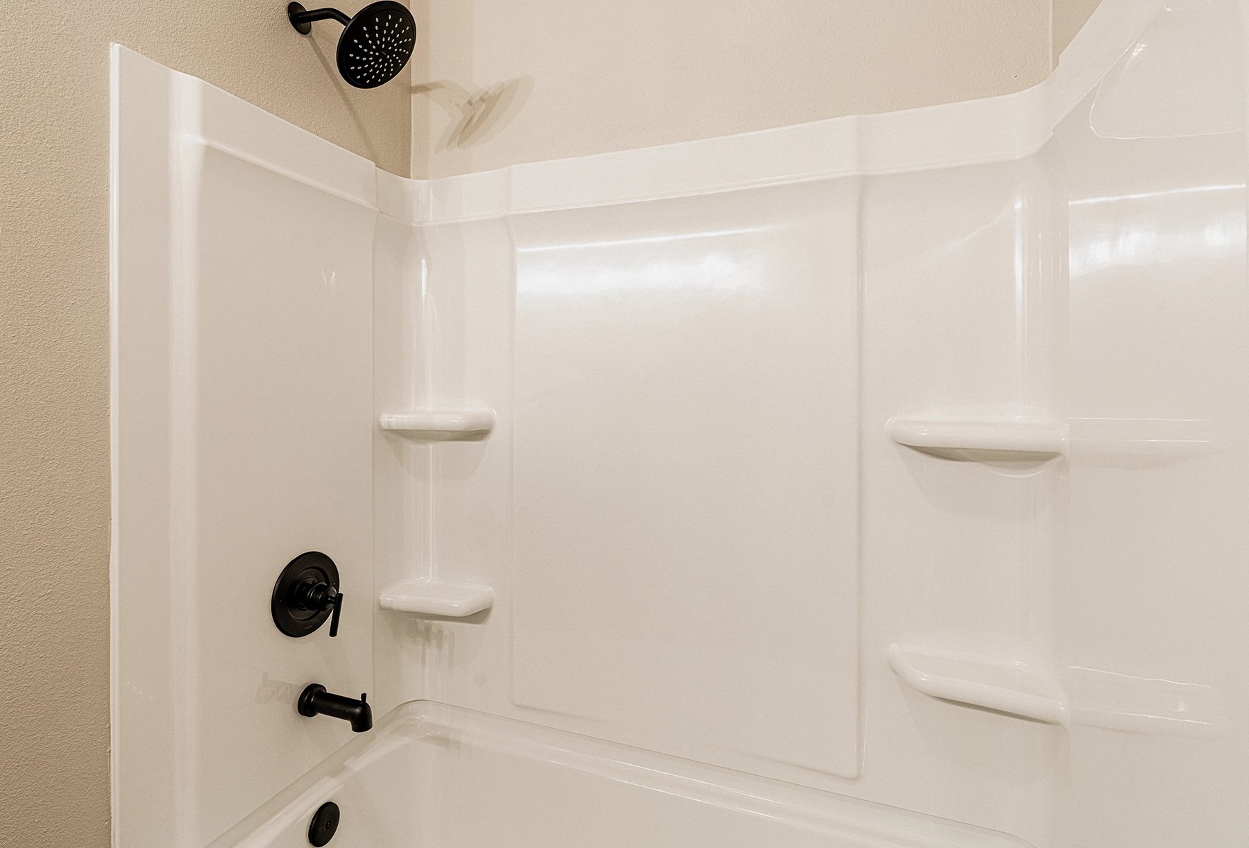 Photo of tub/shower combo in the Vanessa, a Betenbough Homes floor plan.