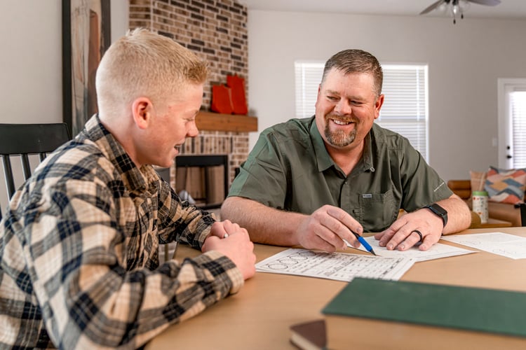 Dad helping son with homework