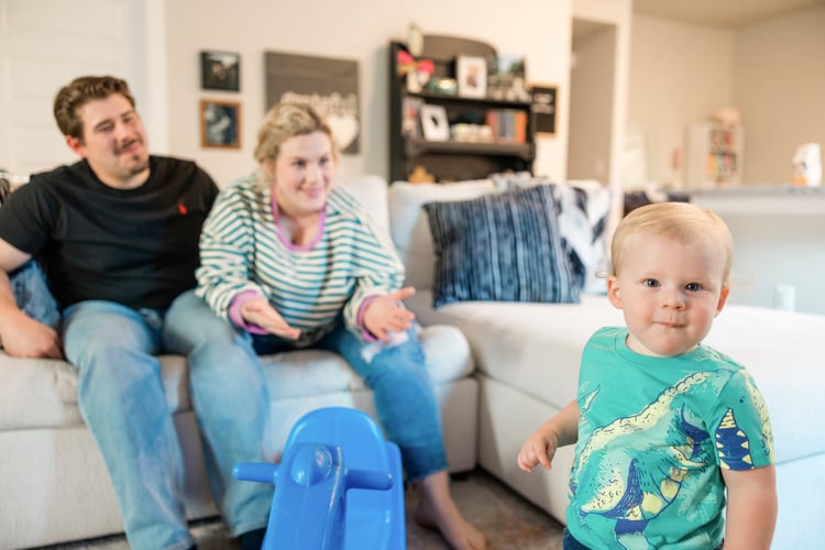 Family playing with their baby in their Betenbough home