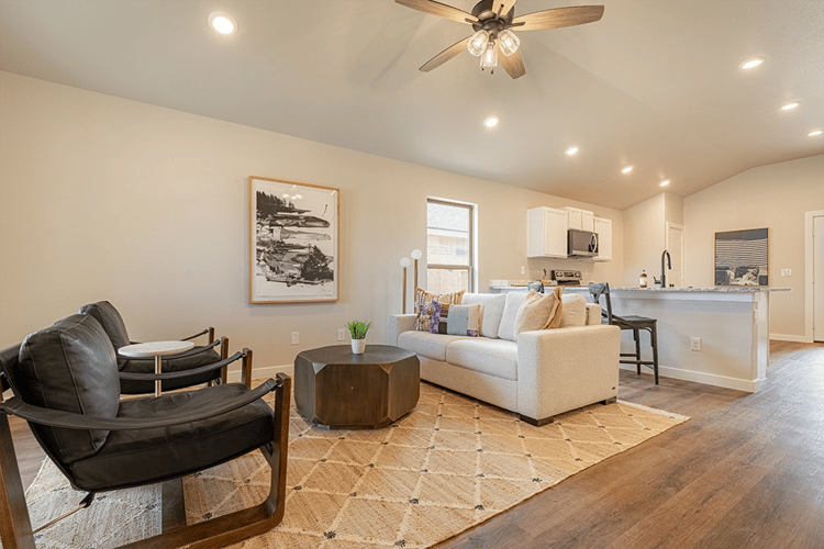 Living area & bar seating in the Giselle, one of Betenbough's homes with kitchen peninsula.