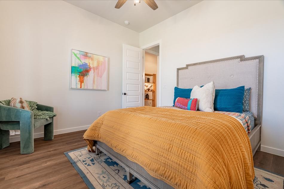 Photo of a staged bedroom in a home by Betenbough Homes, West Texas' #1 home builder.