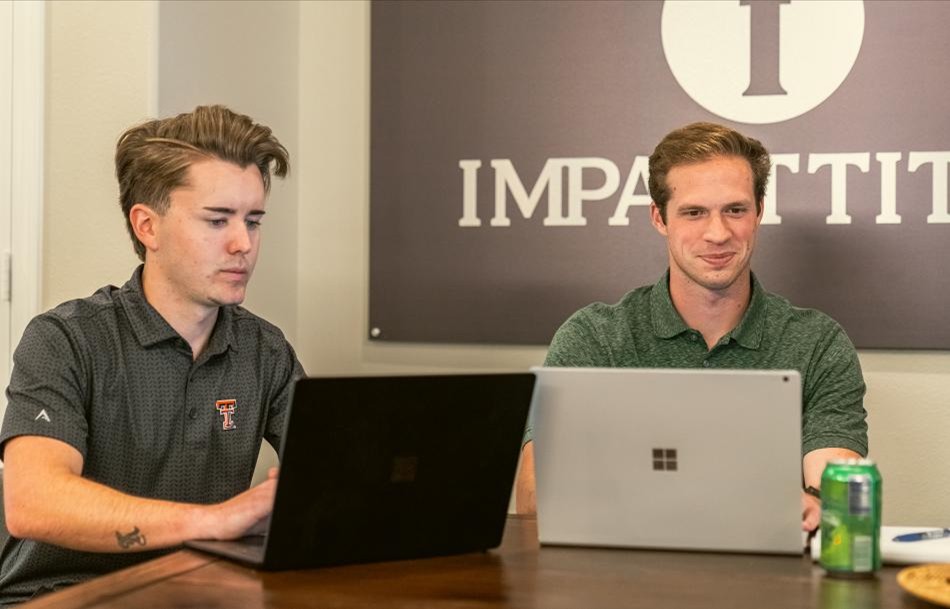 Betenbough Homes and Impact Title teammates calculate a home buyer's closing costs.