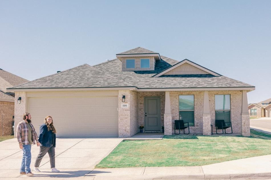 Photo of a couple taking a walk in their Betenbough Homes community.