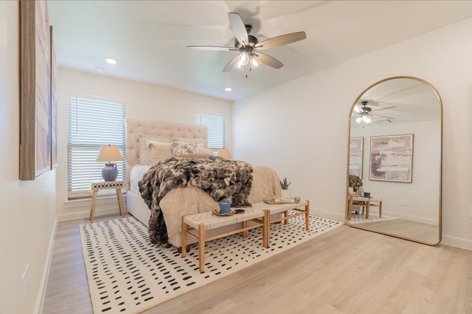 Photo of the staged master bedroom in the Mia - one of Betenbough Homes' Midland's 2025 Parade of Homes entries.