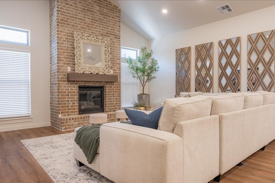 Photo of the living area with fireplace in the Vanessa floor plan - one of Midland's 2025 Parade Homes.