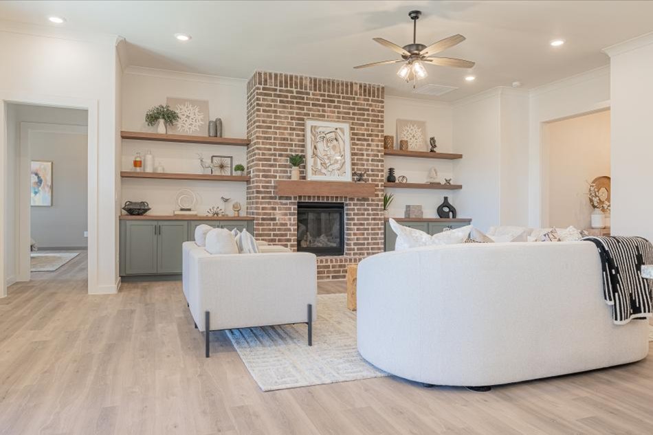 Photo of the staged living room in the 2025 Parade Home entry by Betenbough Homes Odessa.