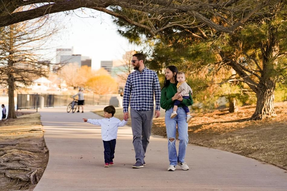 Photo of a young family on a community walking trail.