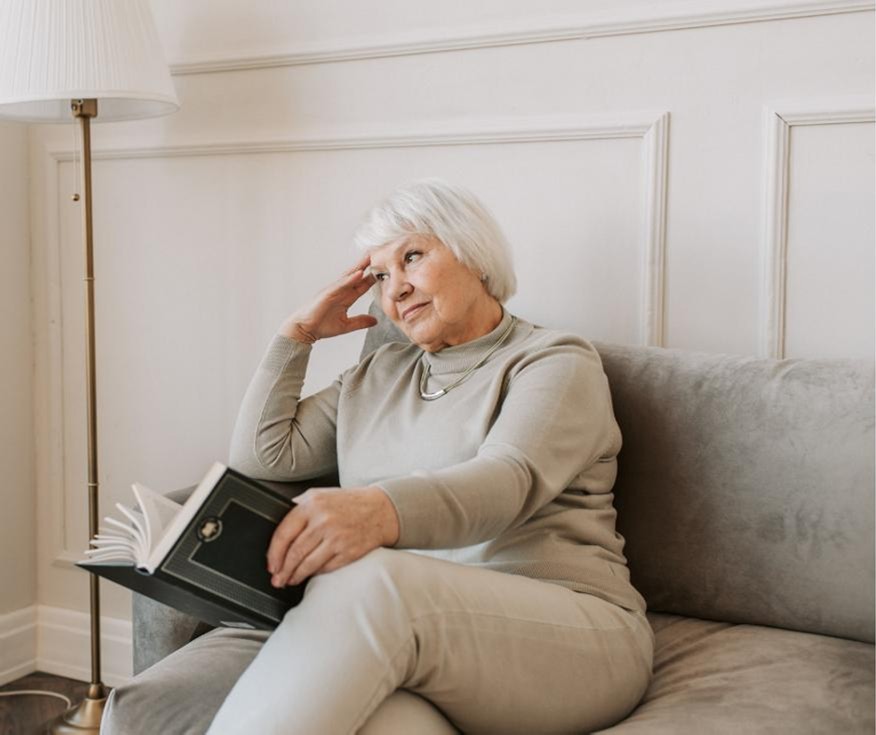 Qualify Comp Photo of an older woman worrying about the cost of housing in her later years.
