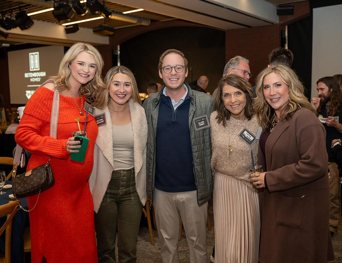 Realtors posing in a photo with Betenbough Homes sales team