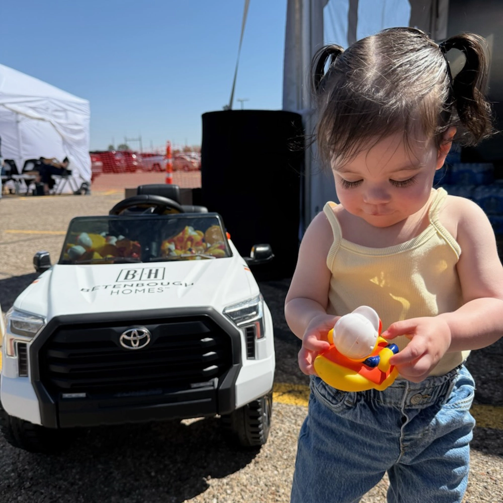 Photo of Betenbough Homes employees presenting a community grants check to a local nonprofit.