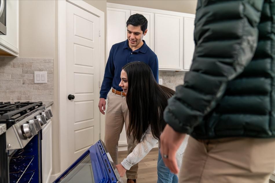 Photo of a couple on a New Home Tour with Betenbough Homes.