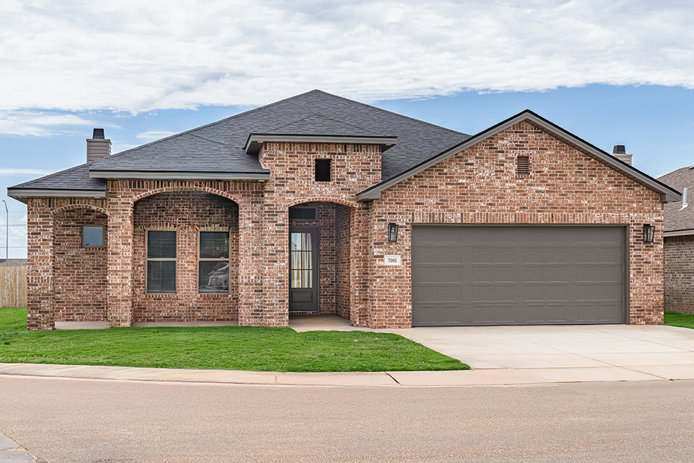 Photo of home buyers choosing their home design options with their New Home Specailist in our Betenbough Homes New Home Center.