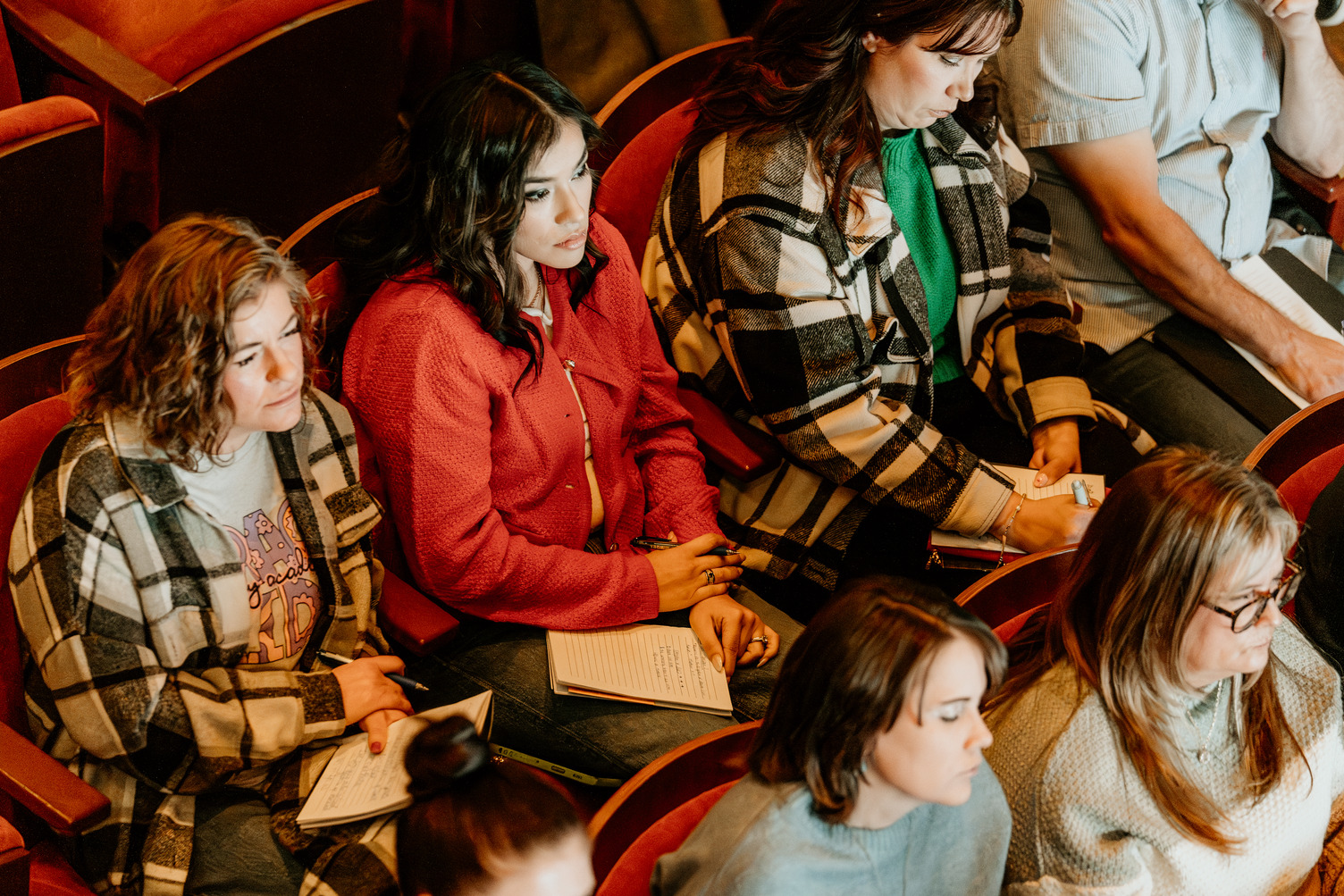 Photo of attendees in the audience of a Work With Purpose Conference.