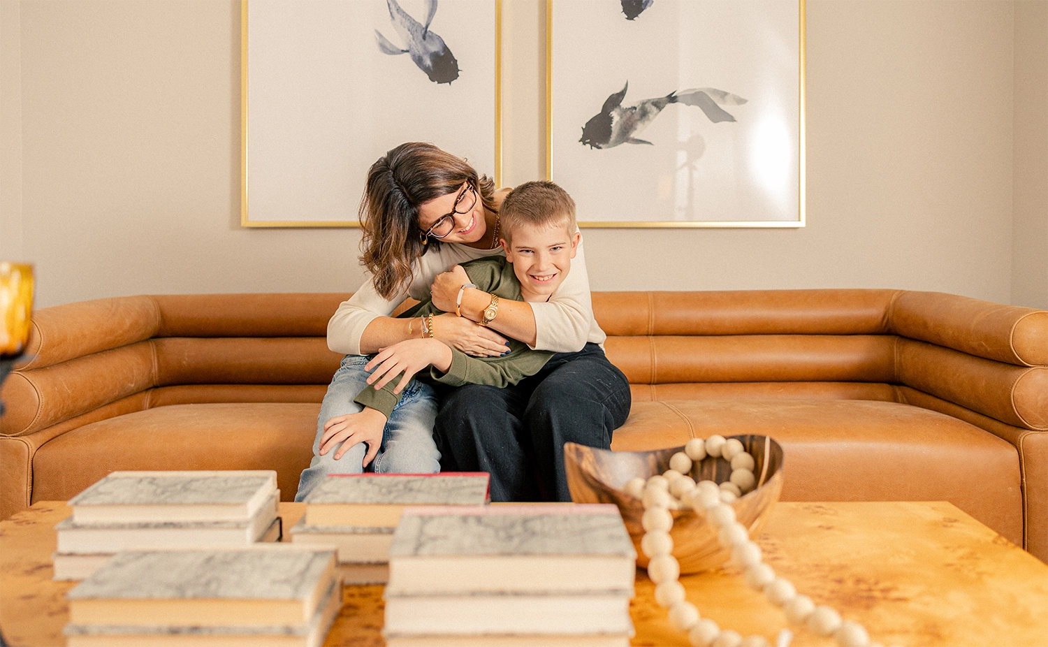 Mom playing with her son in their Betenbough home living room